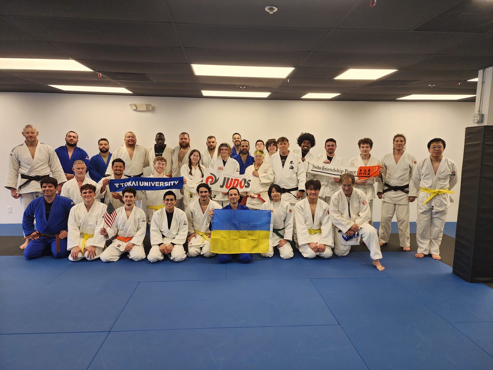 Judo class drilling techniques in gis on the mats