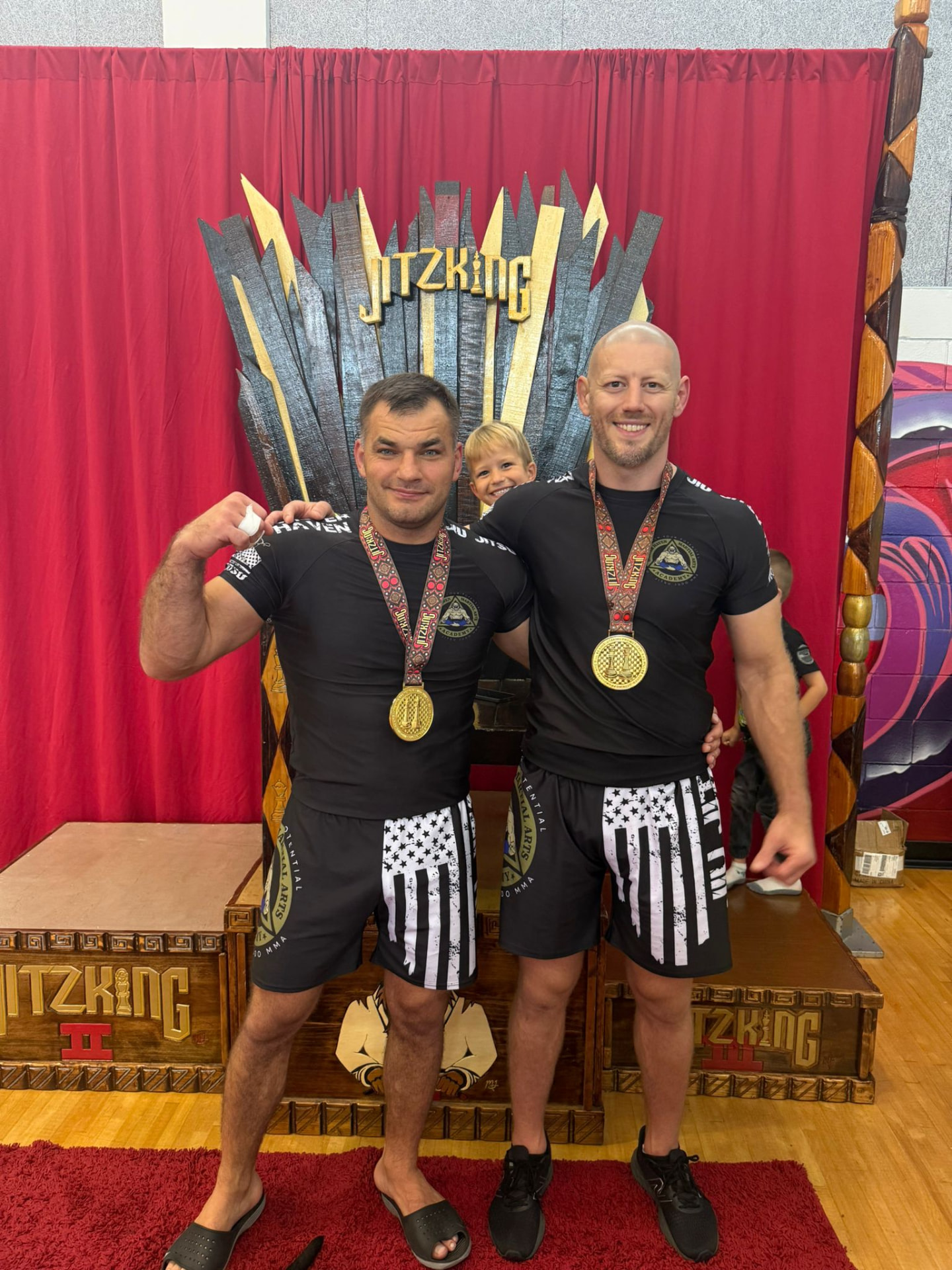 Coaches Alex Blekherov and Vadym Synyavsky with gold medals at the JitzKing King of the Swamp tournament